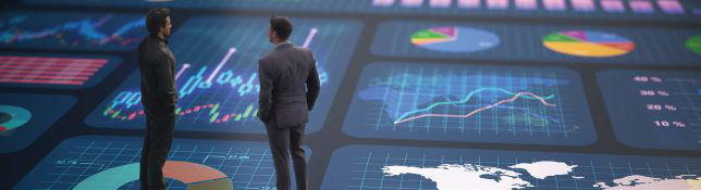 2026 2 February 2 Two people stand in front of a large digital dashboard filled with charts, graphs, and data visualizations.