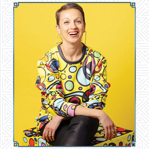 Keynote Speaker Nataly Kogan Keynote Speaker Nataly Kogan against a yellow backdrop.