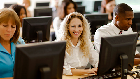 woman at computer smiling
